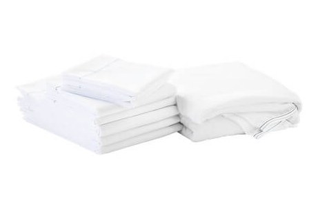 Neatly folded fresh white linens and sheets